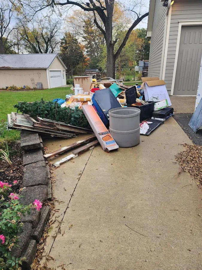 Dumpster being loaded with debris for Estate Cleanout Dumpster Rental in LaGrange